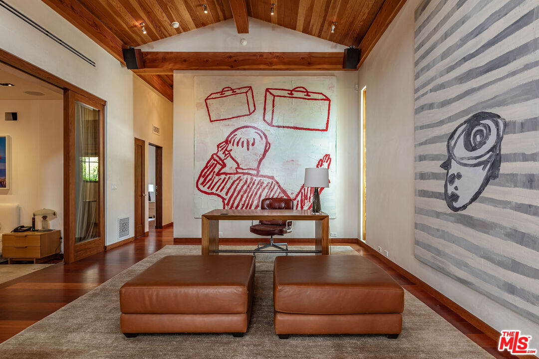 22148 Pacific Coast Highway Malibu, CA 90265 - Photo 11 of 28 a living room with furniture and a wooden floor