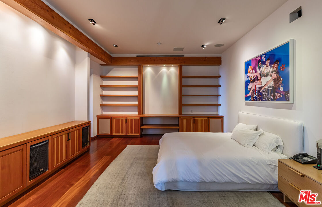 22148 Pacific Coast Highway Malibu, CA 90265 - Photo 23 of 28 a bedroom with a bed and a large window