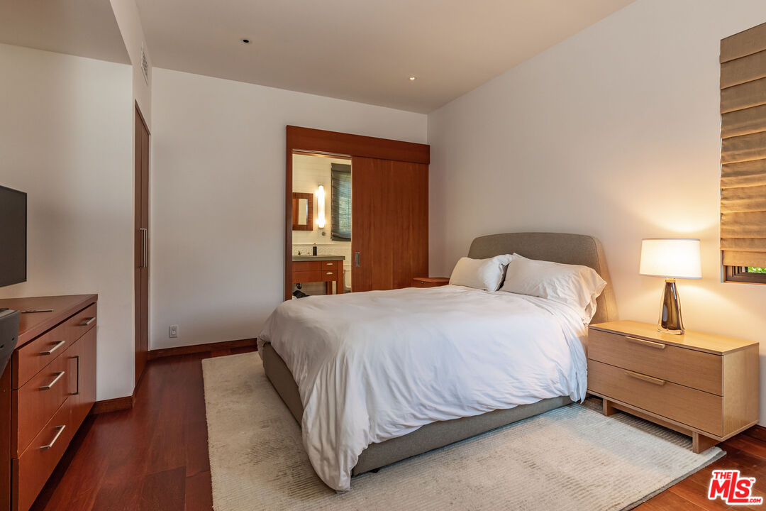 22148 Pacific Coast Highway Malibu, CA 90265 - Photo 25 of 28 a bedroom with a bed and a window