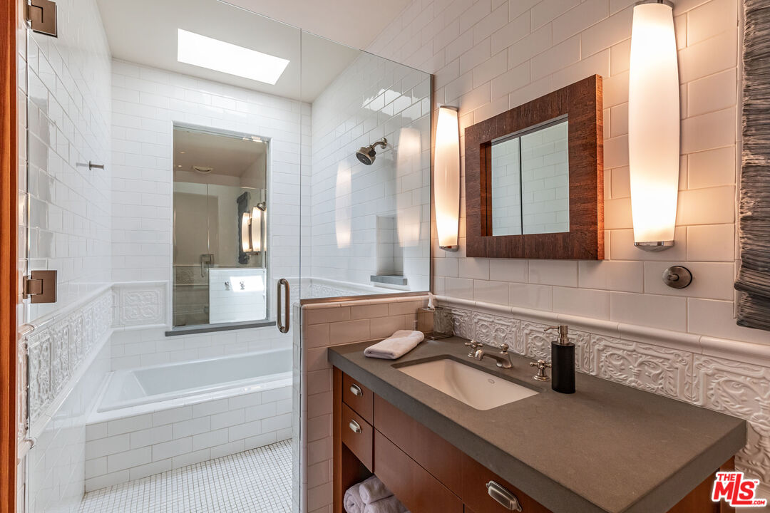 22148 Pacific Coast Highway Malibu, CA 90265 - Photo 26 of 28 a bathroom with a sink and a mirror