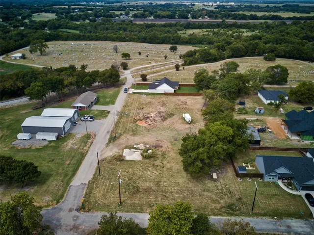 an aerial view of a house with outdoor space
