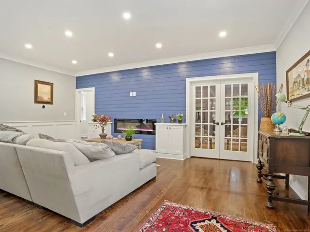 a living room with furniture fireplace and flat screen tv