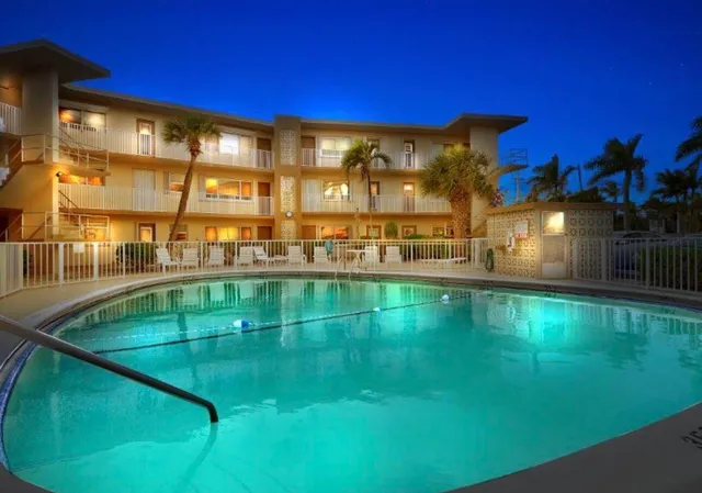 a view of a swimming pool with a yard