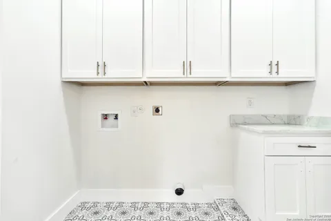 a bathroom with a sink and cabinets