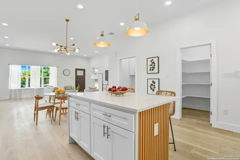 a view of kitchen island and living room