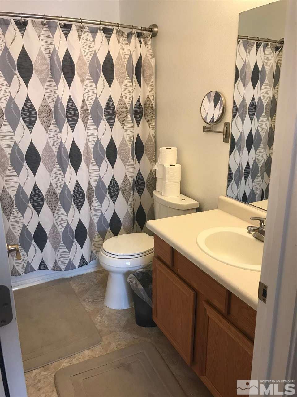 17891 Brushland Drive Reno, NV 89508 - Photo 19 of 25 a bathroom with a toilet and a sink