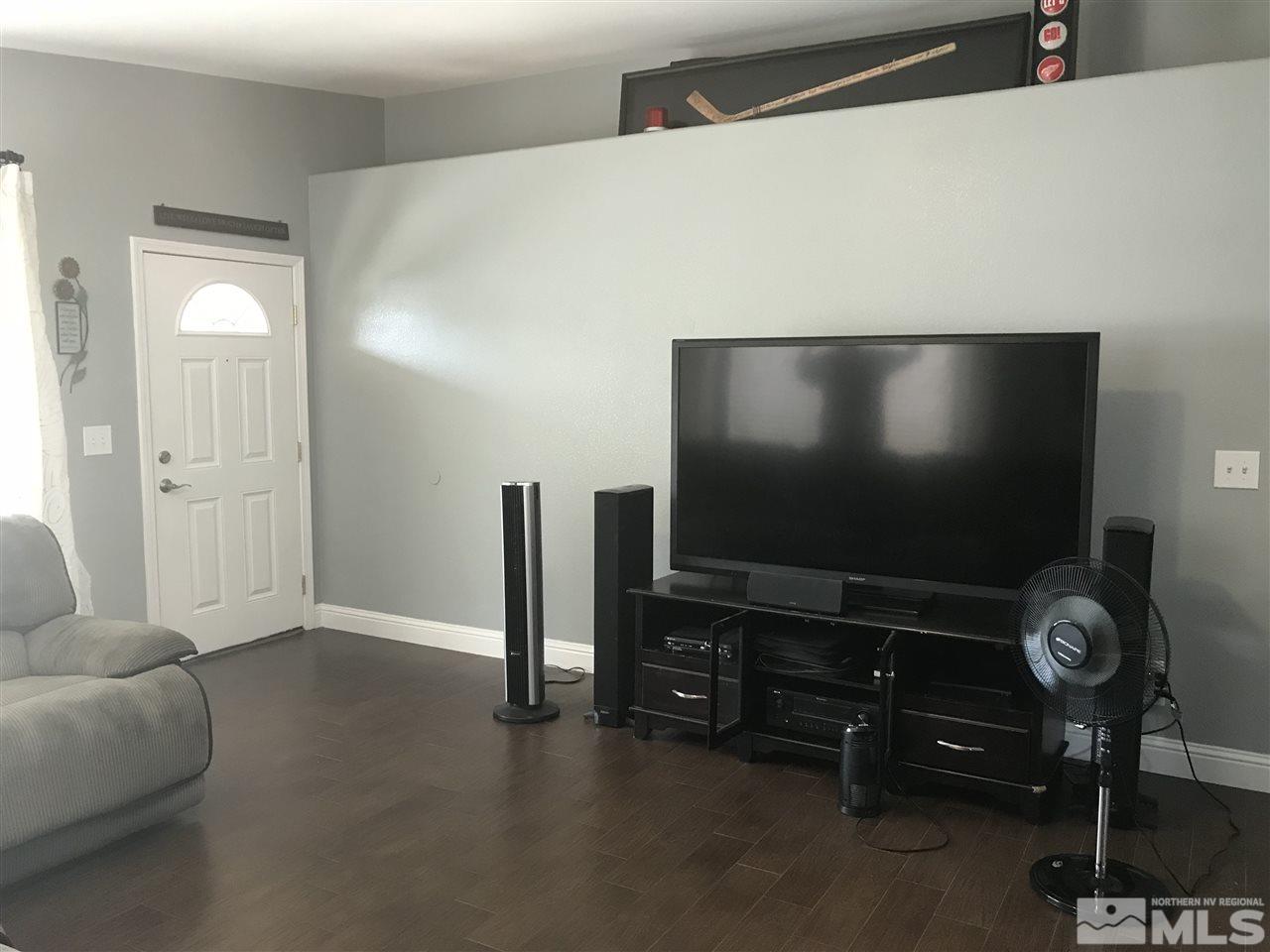 17891 Brushland Drive Reno, NV 89508 - Photo 6 of 25 a living room with furniture and a flat screen tv