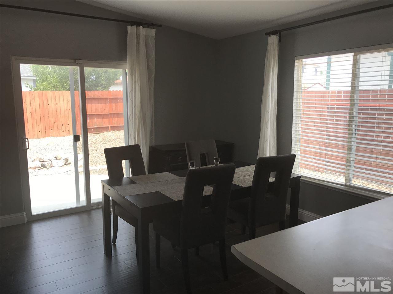 17891 Brushland Drive Reno, NV 89508 - Photo 9 of 25 a view of a dining room with furniture window and outside view