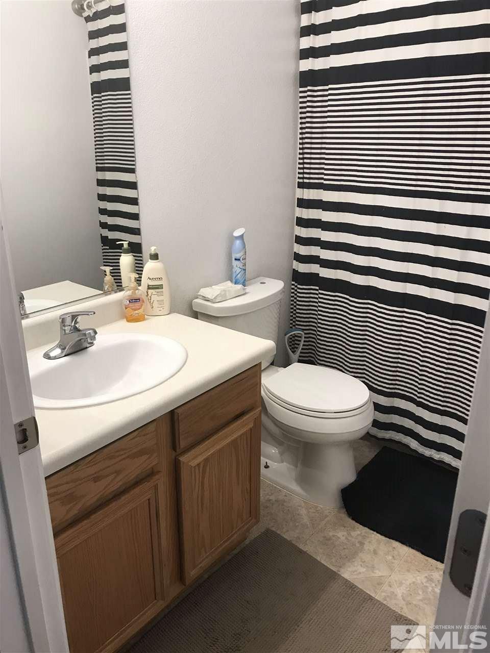 17891 Brushland Drive Reno, NV 89508 - Photo 10 of 25 a bathroom with a sink toilet and shower