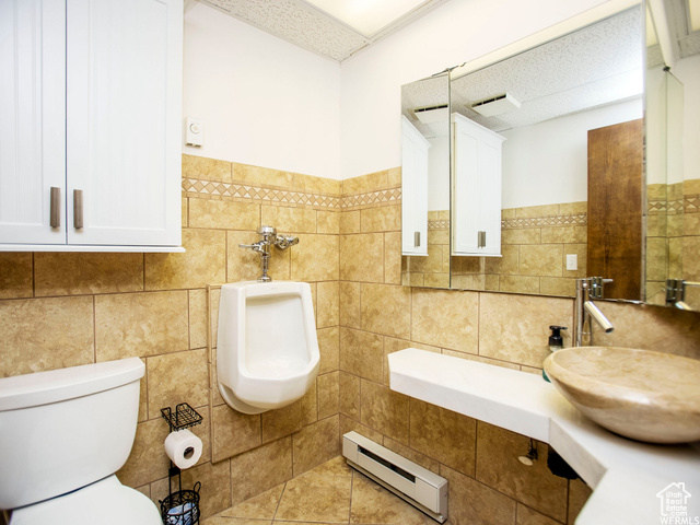 588 Raspberry Patch Road Garden City, UT 84028 - Photo 45 of 74 Bathroom with baseboard heating and tile walls