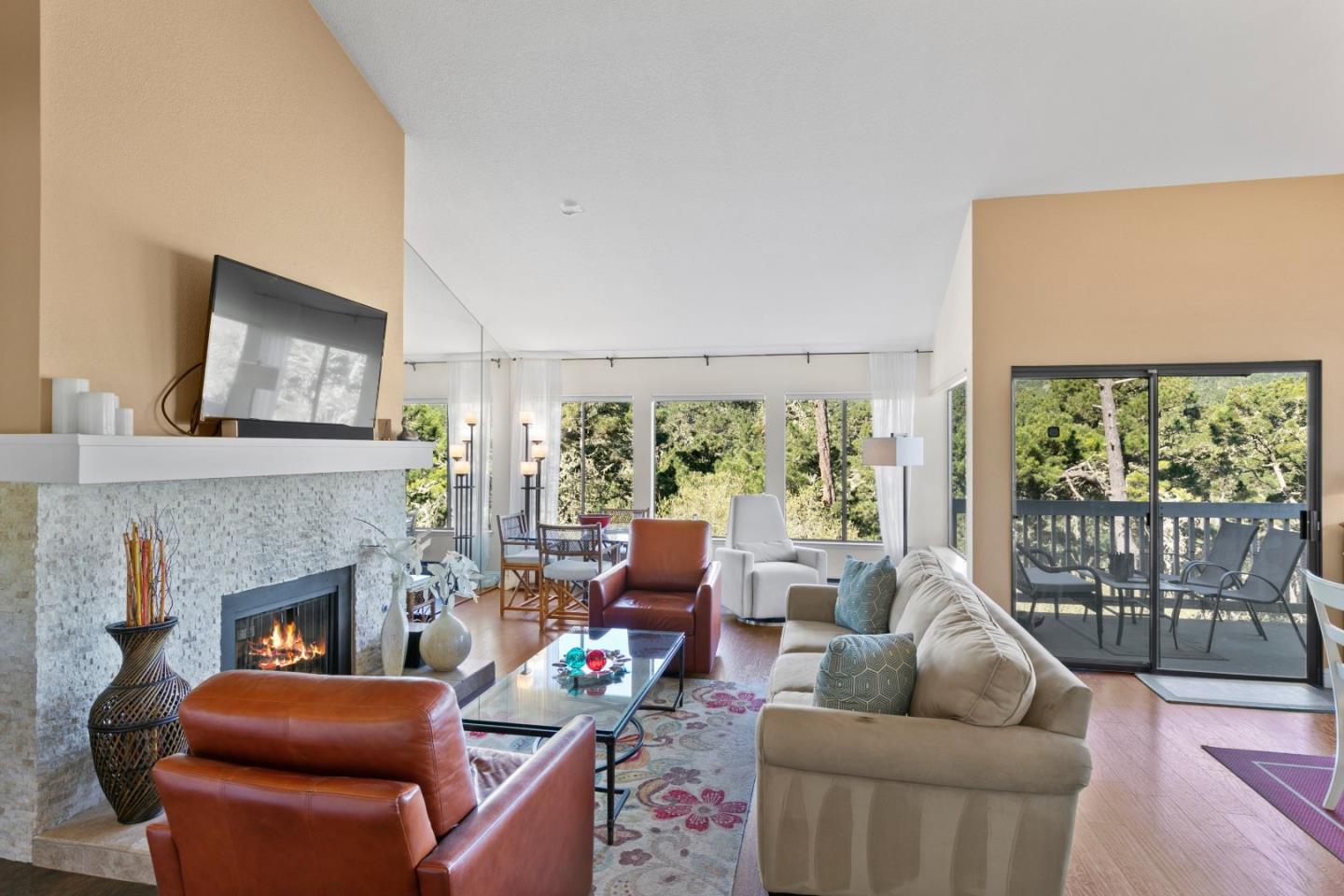 4 Shepherds Knoll Road Monterey, CA 93940 - Photo 13 of 28 a living room with furniture a large window and a fireplace