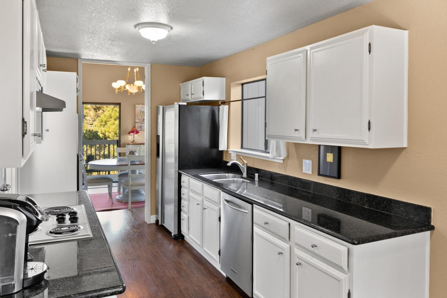 4 Shepherds Knoll Road Monterey, CA 93940 - Photo 16 of 28 a kitchen with granite countertop a sink stove and refrigerator