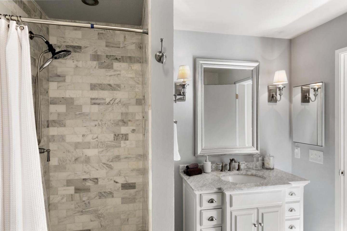 4 Shepherds Knoll Road Monterey, CA 93940 - Photo 25 of 28 a bathroom with a sink vanity granite and shower