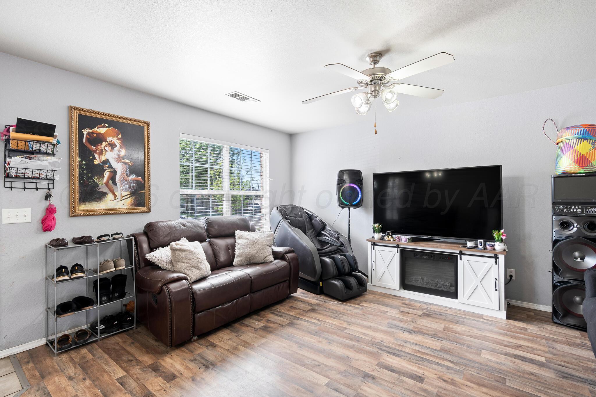 1921 South Fairfield Street Amarillo, TX 79103 - Photo 3 of 18 a living room with furniture and a flat screen tv