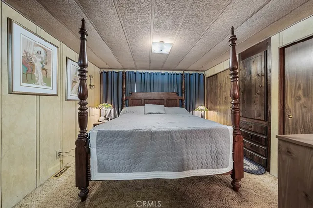 a bed room with a bed and a walk in closet