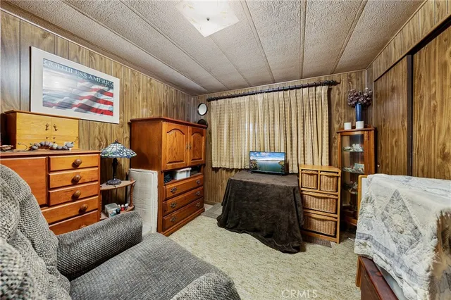 a bedroom with furniture and a bed