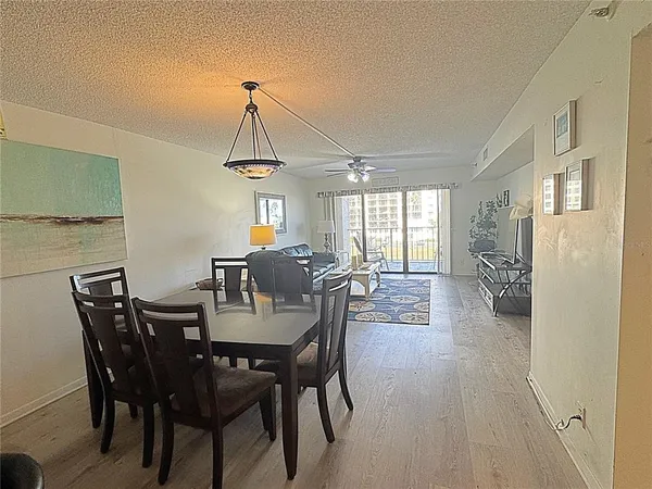 a view of a dining room with furniture and window