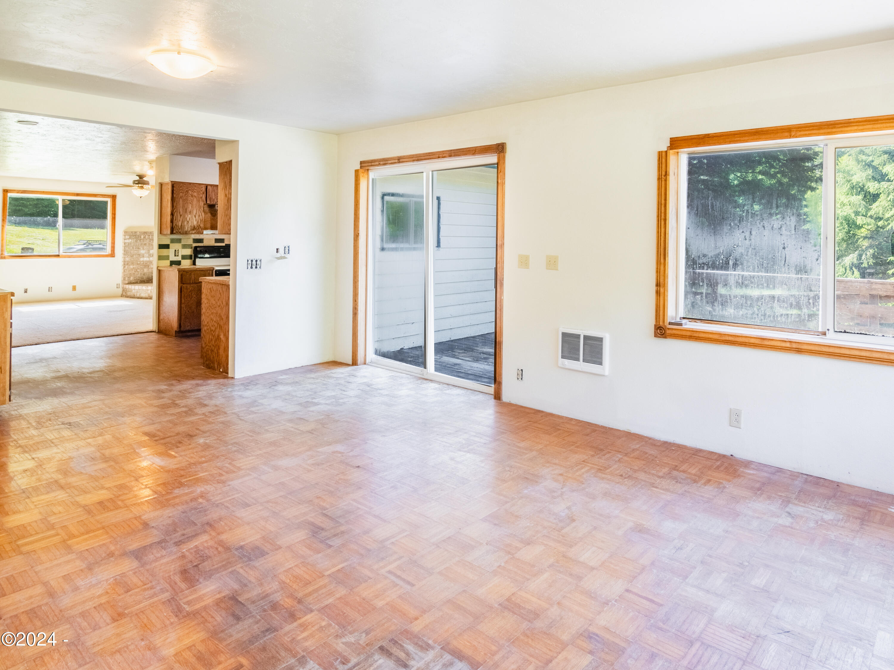 909 Christiansen Road Toledo, OR 97391 - Photo 19 of 43 Family Room into Kitchen