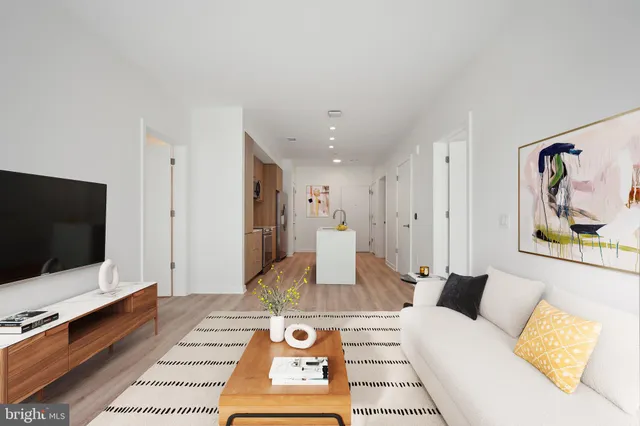 a living room with a flat screen tv and a couch