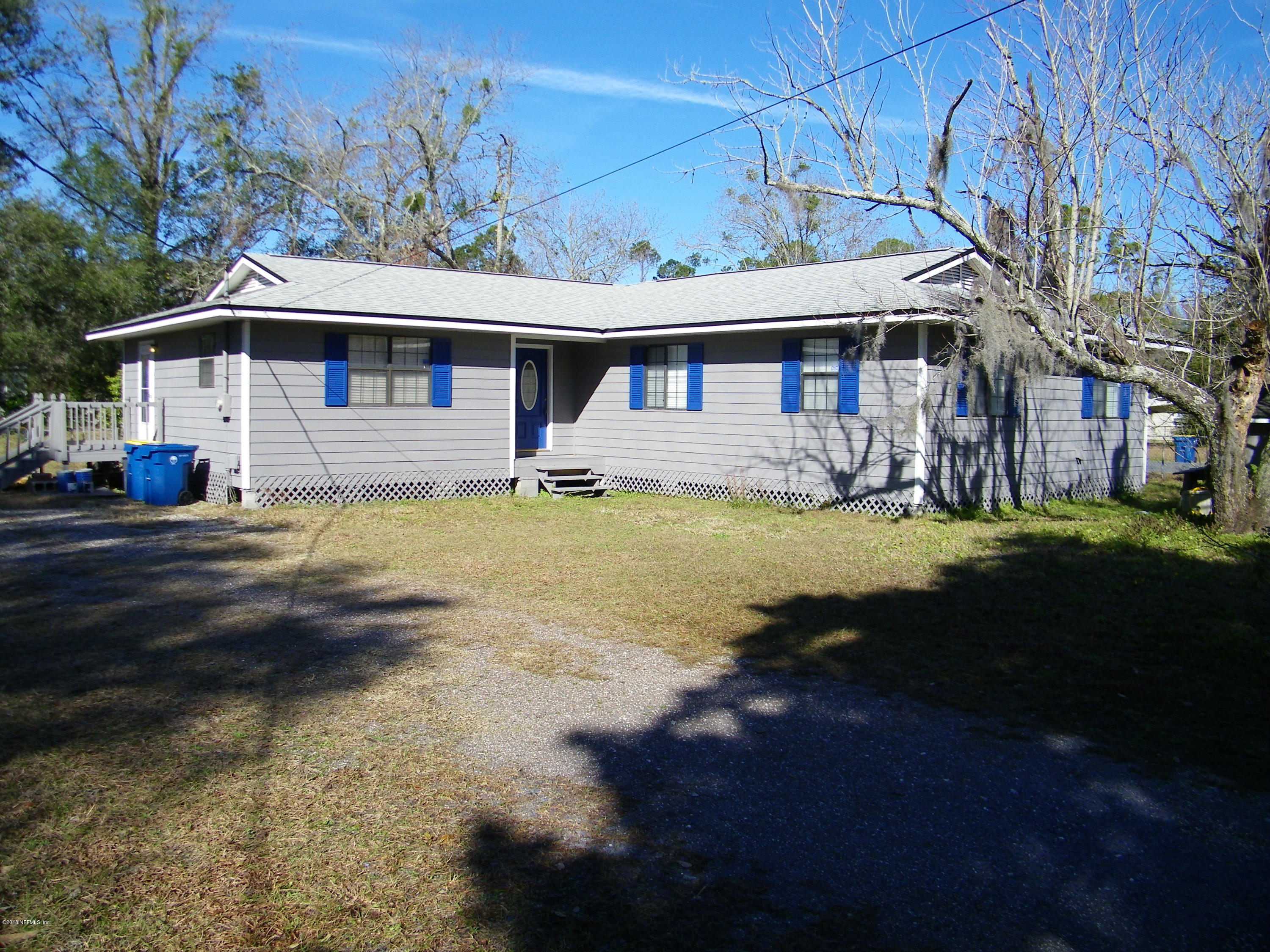13296 Yellow Bluff Road Jacksonville, FL 32226 - Photo 1 of 13 a front view of a house with a yard