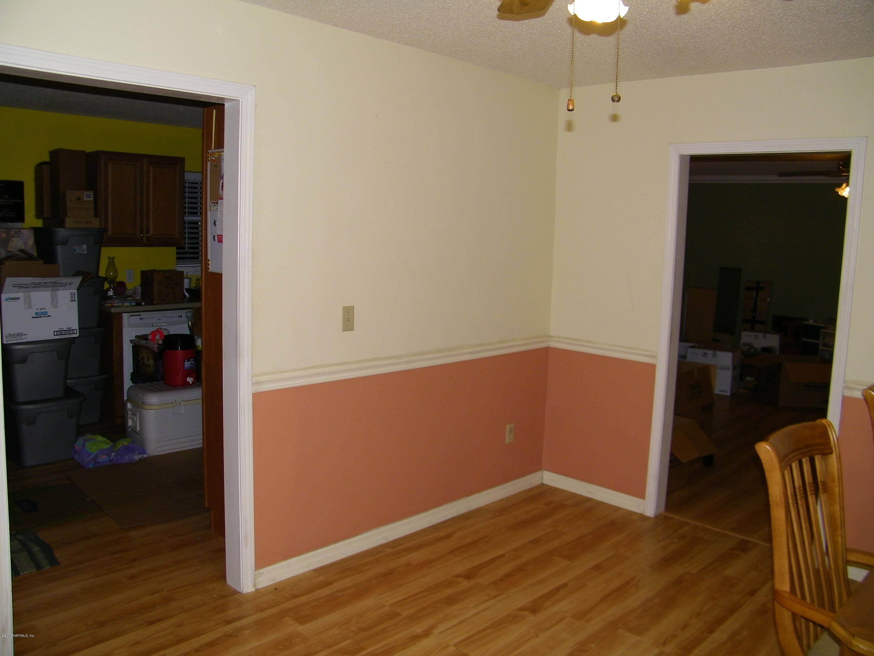 13296 Yellow Bluff Road Jacksonville, FL 32226 - Photo 6 of 13 an empty room with wooden floor and closet
