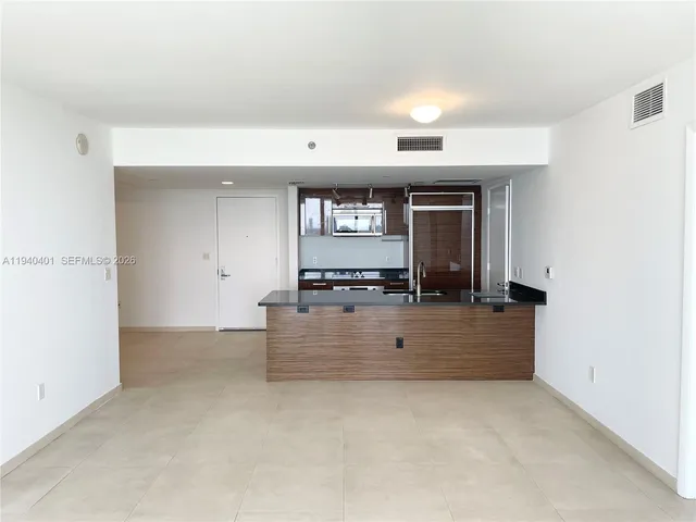 a view of kitchen and front door
