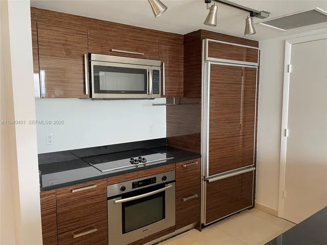 a kitchen with a stove and a microwave