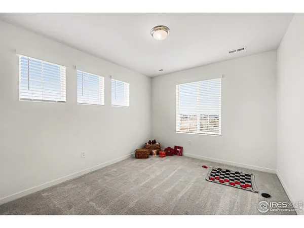 a room with a bed and a window