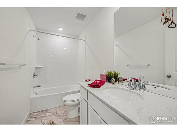 a bathroom with a sink a mirror and vanity