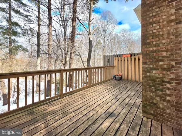 a view of wooden balcony with a pot
