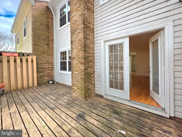 a view of a house with a door and wooden floor