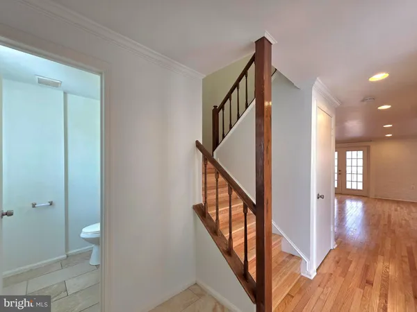 a view of an entryway with wooden floor