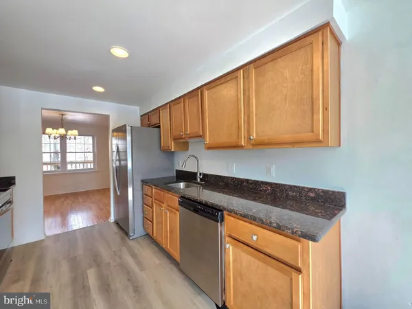 a kitchen that has a sink and a stove in it