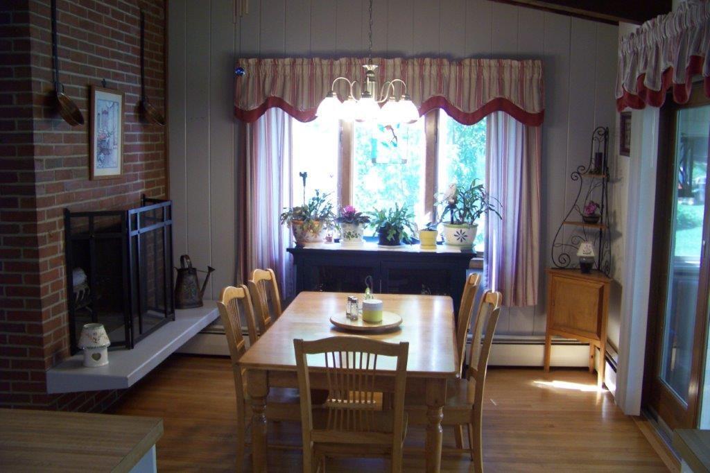 5 Green Street Springvale, ME 04083 - Photo 15 of 34 Dining room w/ wood burning fireplace.