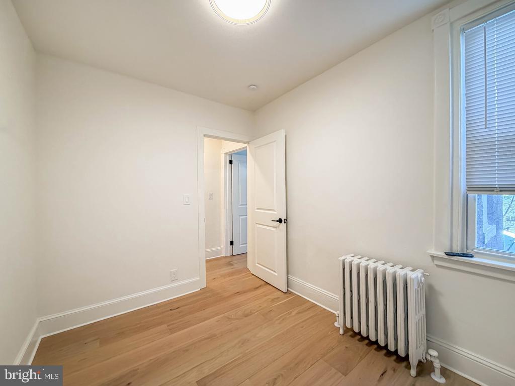 213 New Brook Street Bristol, PA 19007 - Photo 27 of 37 a view of a room with wooden floor and windows