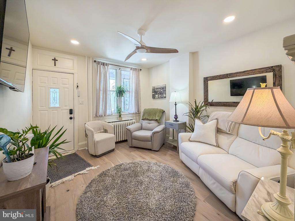 213 New Brook Street Bristol, PA 19007 - Photo 4 of 37 a living room with furniture and a potted plant