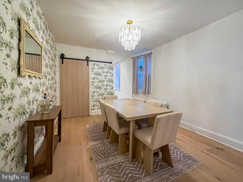 213 New Brook Street Bristol, PA 19007 - Photo 7 of 37 a view of a dining room with furniture and a chandelier