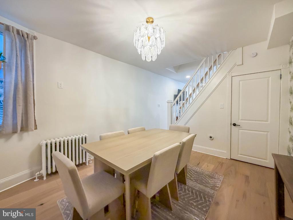 213 New Brook Street Bristol, PA 19007 - Photo 8 of 37 a view of a dining room with furniture and a chandelier