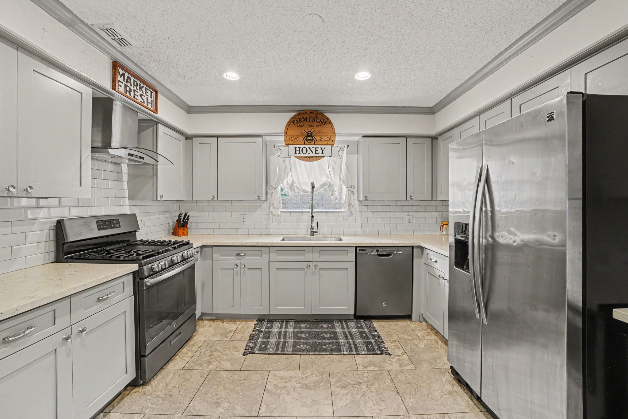 9530 Arcade Drive Spring, TX 77379 - Photo 13 of 32 This impressive kitchen is sure to impress with its modern style, thoughtful design, and dual pantries.