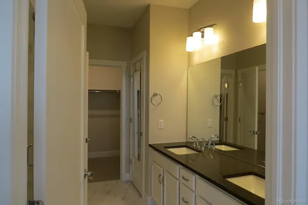 a bathroom with a sink and shower