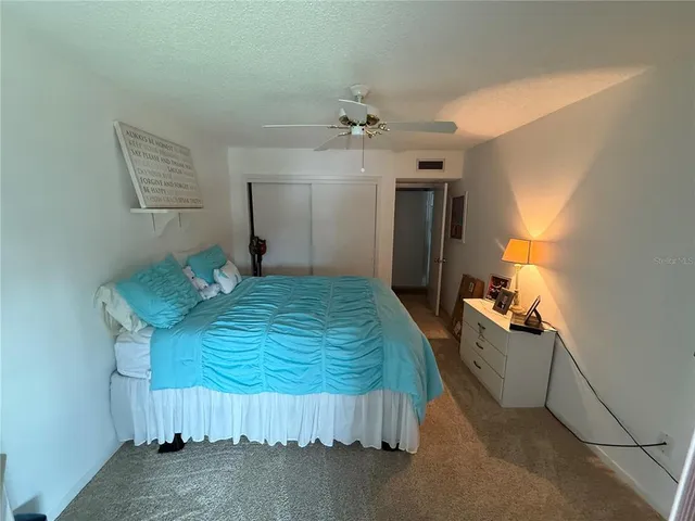 a bedroom with bed and window