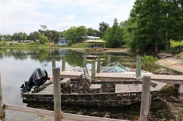 a view of a wooden deck and lake