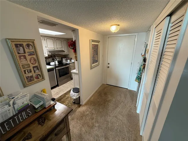 a view of a workspace with furniture and workspace