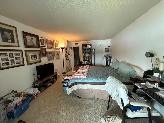 a room with furniture and a flat screen tv