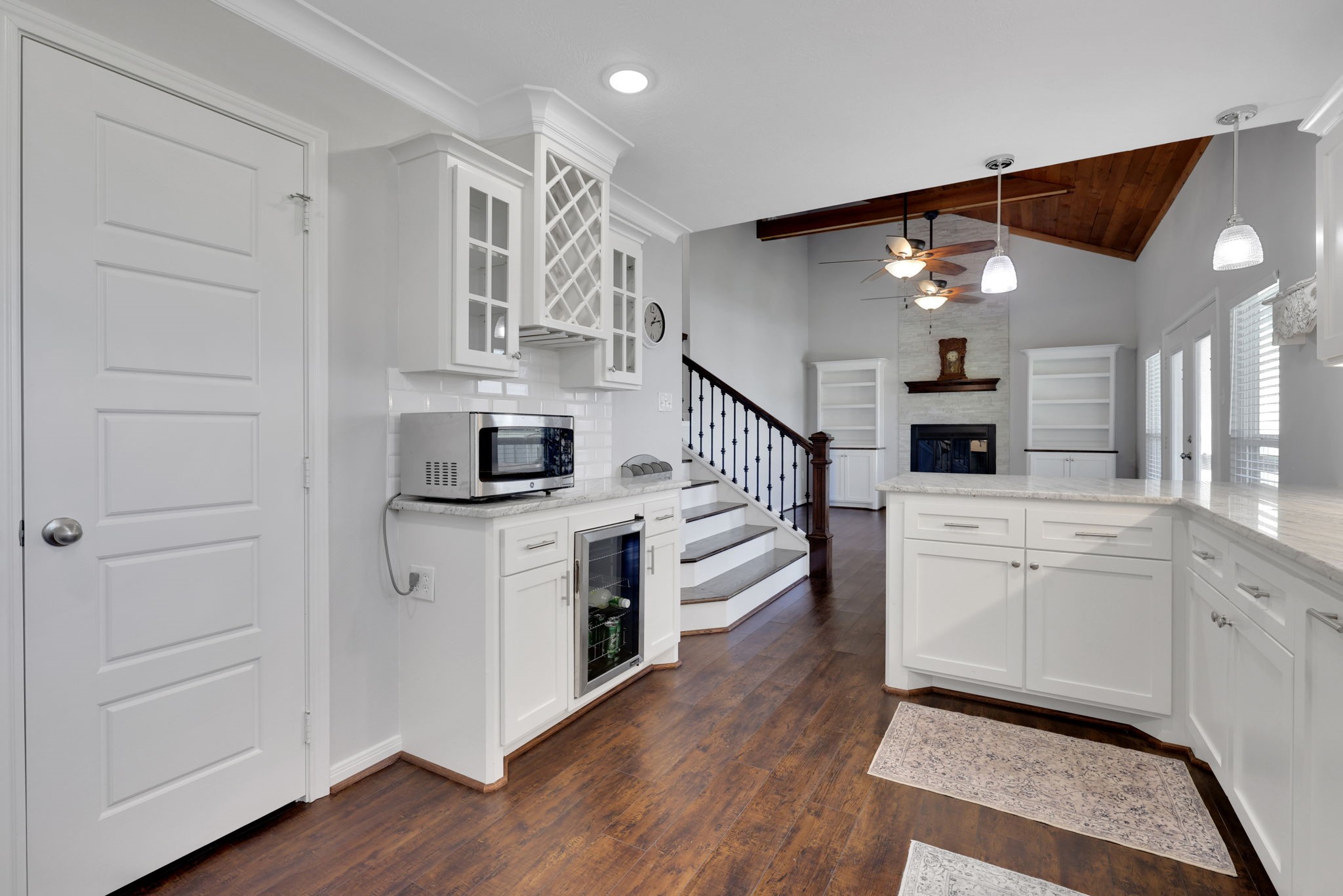 20 Ridgeway Drive Coldspring, TX 77331 - Photo 3 of 40 Kitchen features a spacious walk in pantry and a dedicated wine station along with plenty of cabinets for all of your storage needs.