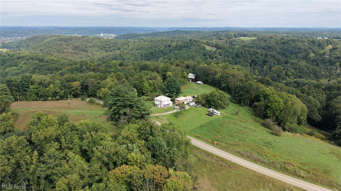 0 Southwest Kings Ridge Road Newcomerstown, OH 43832 - Photo 1 of 3 Expansive wooded landscape with scattered clearings
