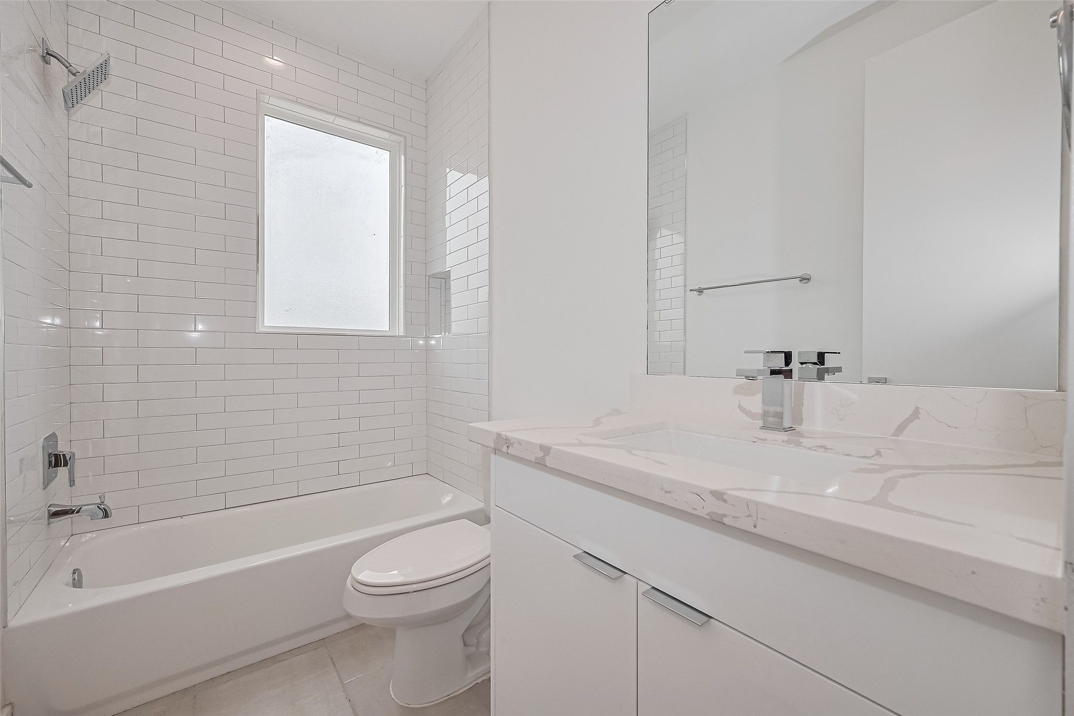 3510 Hadley Street Houston, TX 77004 - Photo 34 of 48 With a large window, soaking tub and shower combo, and a clean white vanity, this full bath is both stylish and practical—perfect for guests or residents alike.