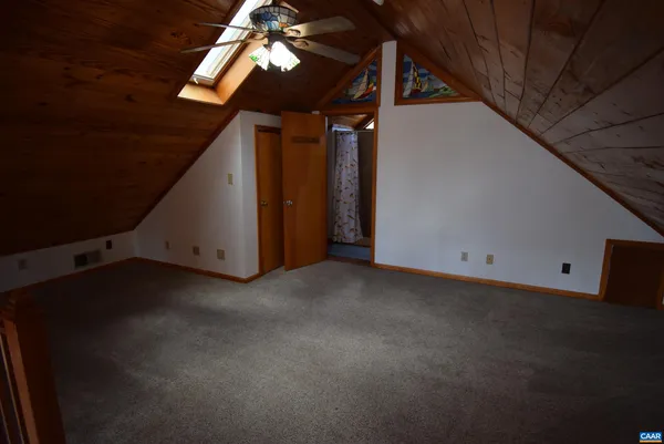 a view of empty room with ceiling fan