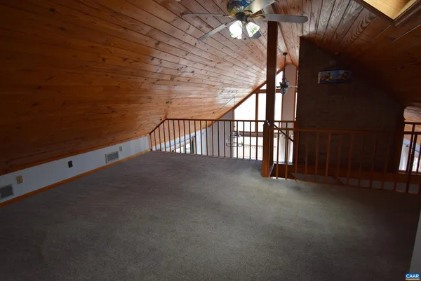 a view of a livingroom with stairs