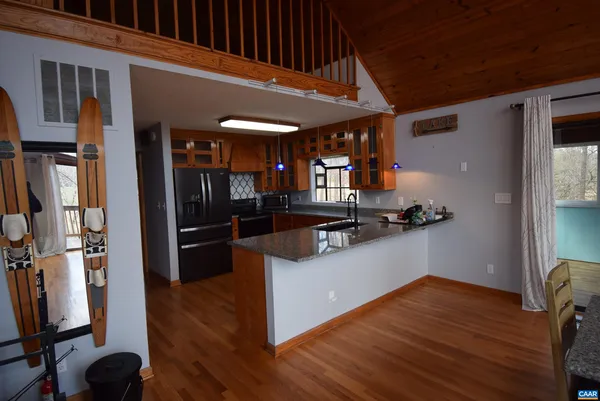 a view of kitchen with wooden floor